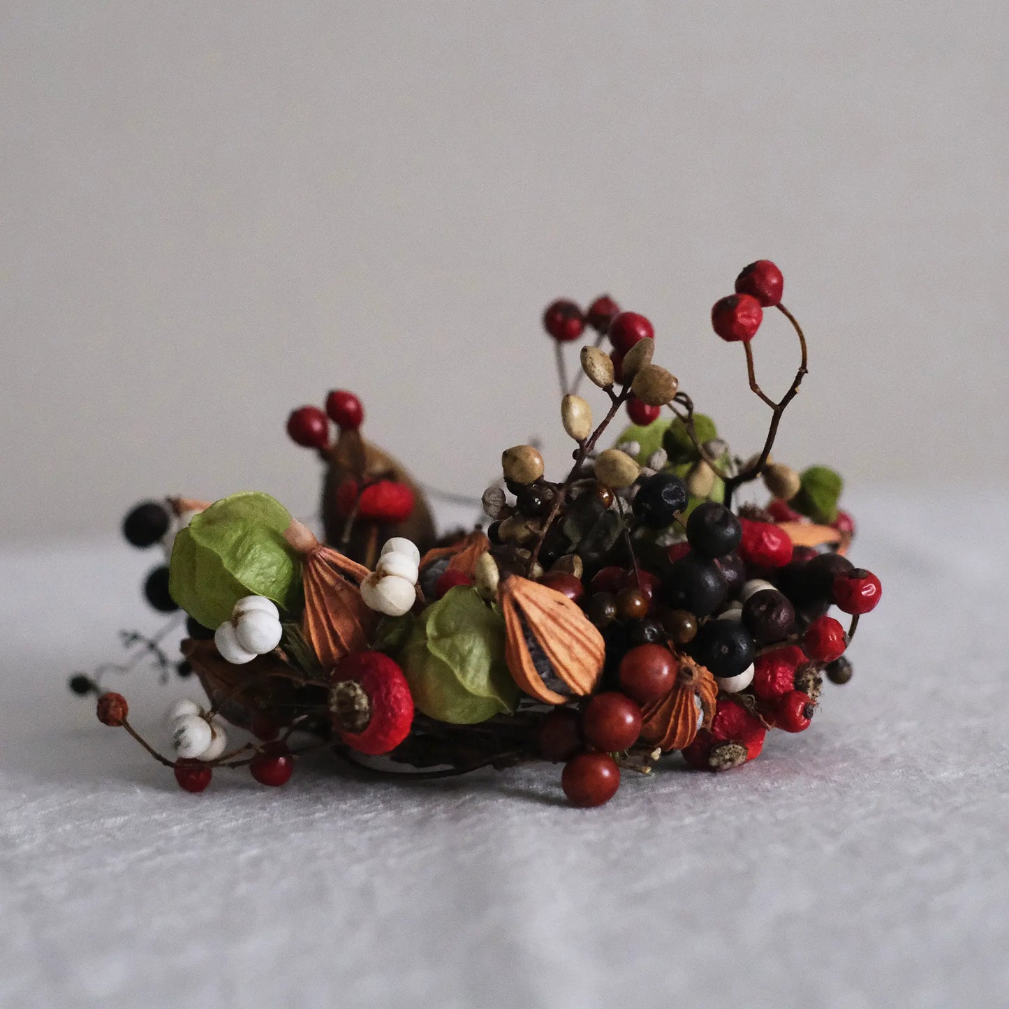 
                  
                    木の実のキャンドルリース (S)
                  
                